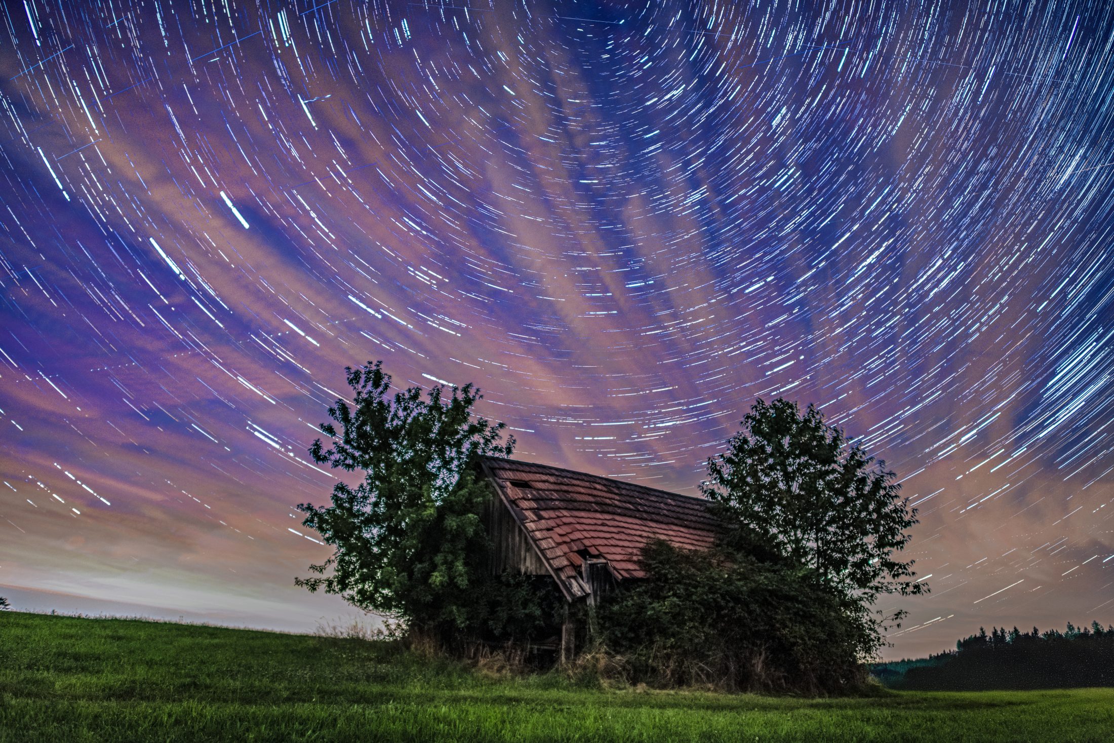 Celestial Arcs Over Rustic Barn